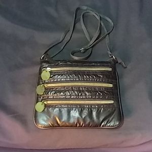 Gray purse with gold zippers